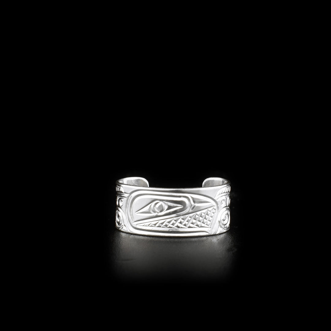 This sterling silver toe ring has a cuff band with a gap in the back. There is a depiction of the Salmon that has been carved into the surface of the band.