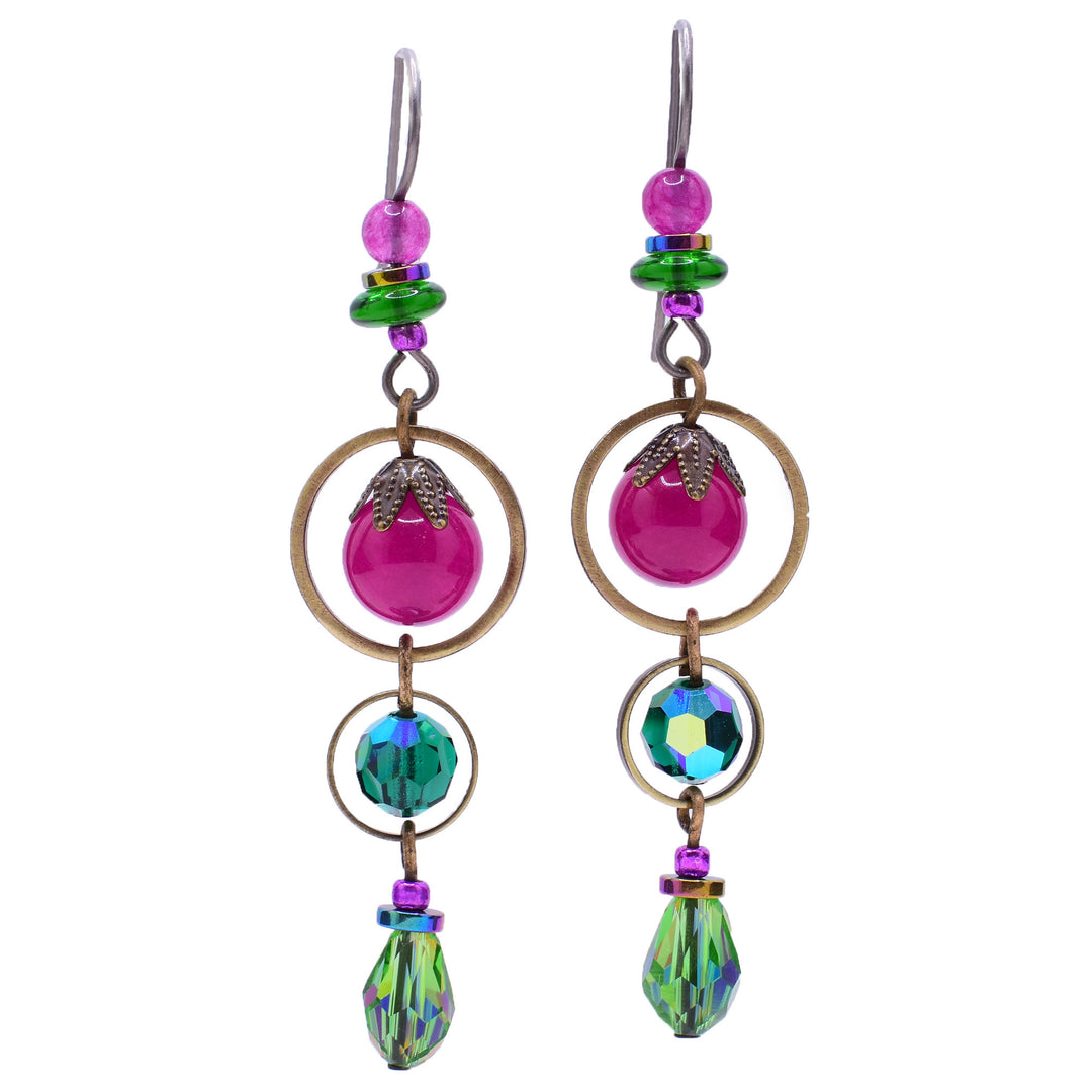 Dangle drop earrings made of Austrian crystal, handworked brass, hematine, glass, and quartz. Titanium hooks. By Honica.