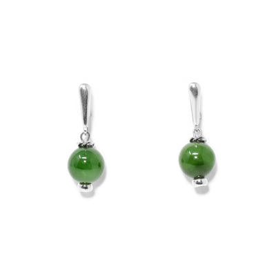 Round BC jade beads, 0.4” in diameter, hang from silver lever-back hooks. Silver ring adornments on and under beads. All metal is sterling silver.