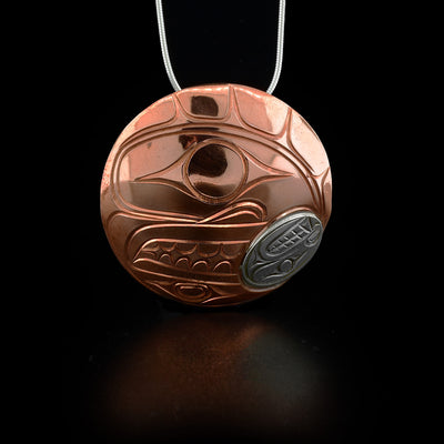 Round, domed orca pendant made of copper and sterling silver. Hidden bail on back. By Kwakwaka’wakw artist Paddy Seaweed.