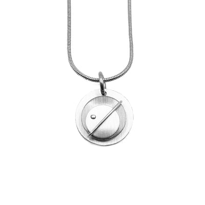 Brushed and anodized layered aluminum circle pendant. Stainless steel snake chain included. By JR Franco.