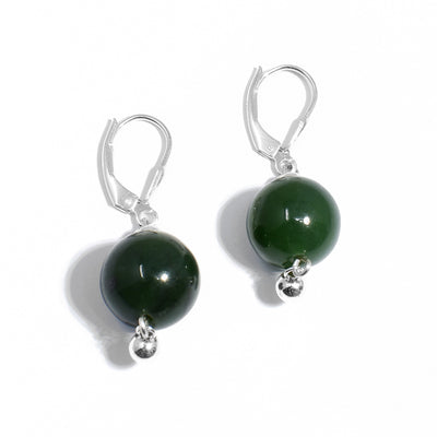 Each earring is a round BC jade bead with a small, round silver bead dangling below. Lever-back hooks. Made using BC jade and sterling silver.