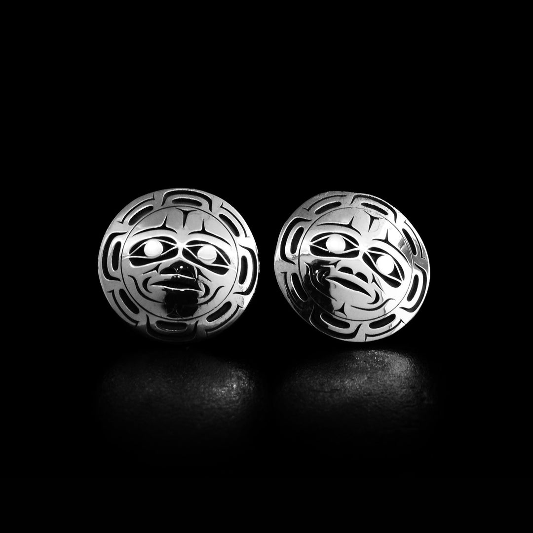 These circle stud earrings are made from sterling silver. There are depictions of the Moon that have been cast into the surface of the earrings.