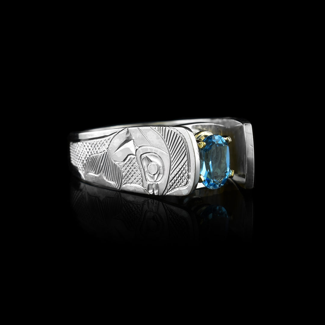 Salmon legend the Blue Topaz is held with 14k gold prong  Solitaire Ring