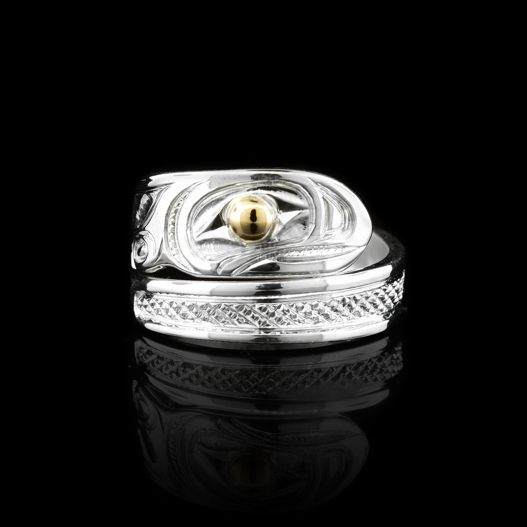 This Salmon ring has been crafted with sterling silver and the eye is made out of 14k gold.