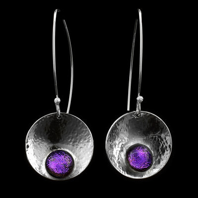These dangling circle drop earrings have concaved, circle shaped hangs that have been embossed with purple fused glass beads held at the bottom of the hangs. The hangs are held from long wire hooks giving the earrings a long, elegant appearance.