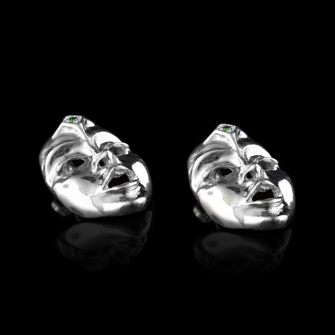 Seer Mask Stud Earrings made with sterling silver and green diamonds.