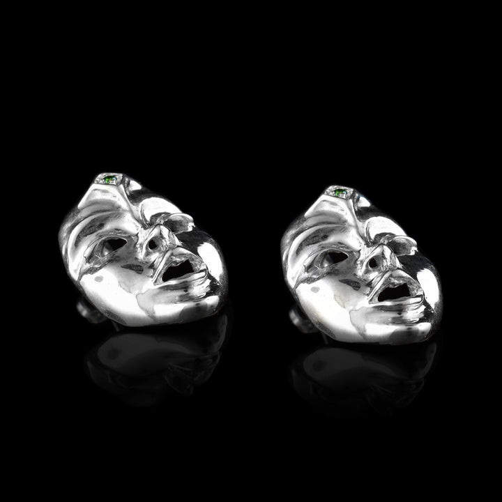 Seer Mask Stud Earrings made with sterling silver and green diamonds.