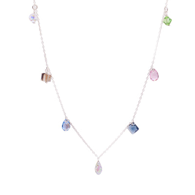 Dazzling seven crystals necklace handcrafted by artist Debra Nelson. Made of sterling silver and seven Swarovski Crystals. The necklace measures 20" long.