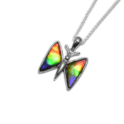 Flying sterling silver butterfly. Triangular wings are open and filled with AA-grade ammolite.