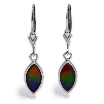 These marquise earrings were handcrafted by Enchanted Designs. They were made using silver and ammolite.  The earrings measure 1.25" x 0.25".