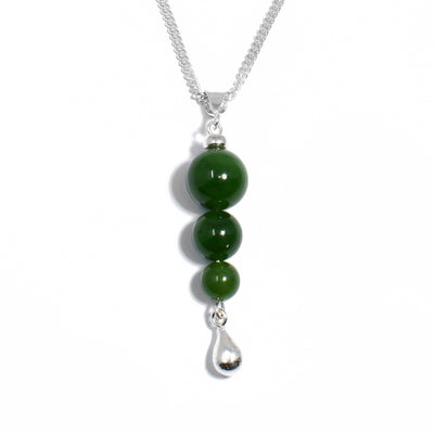 Three round BC jade beads stacked below the bail. Biggest to smallest from top to bottom. Small, silver teardrop adornment dangles at bottom.
