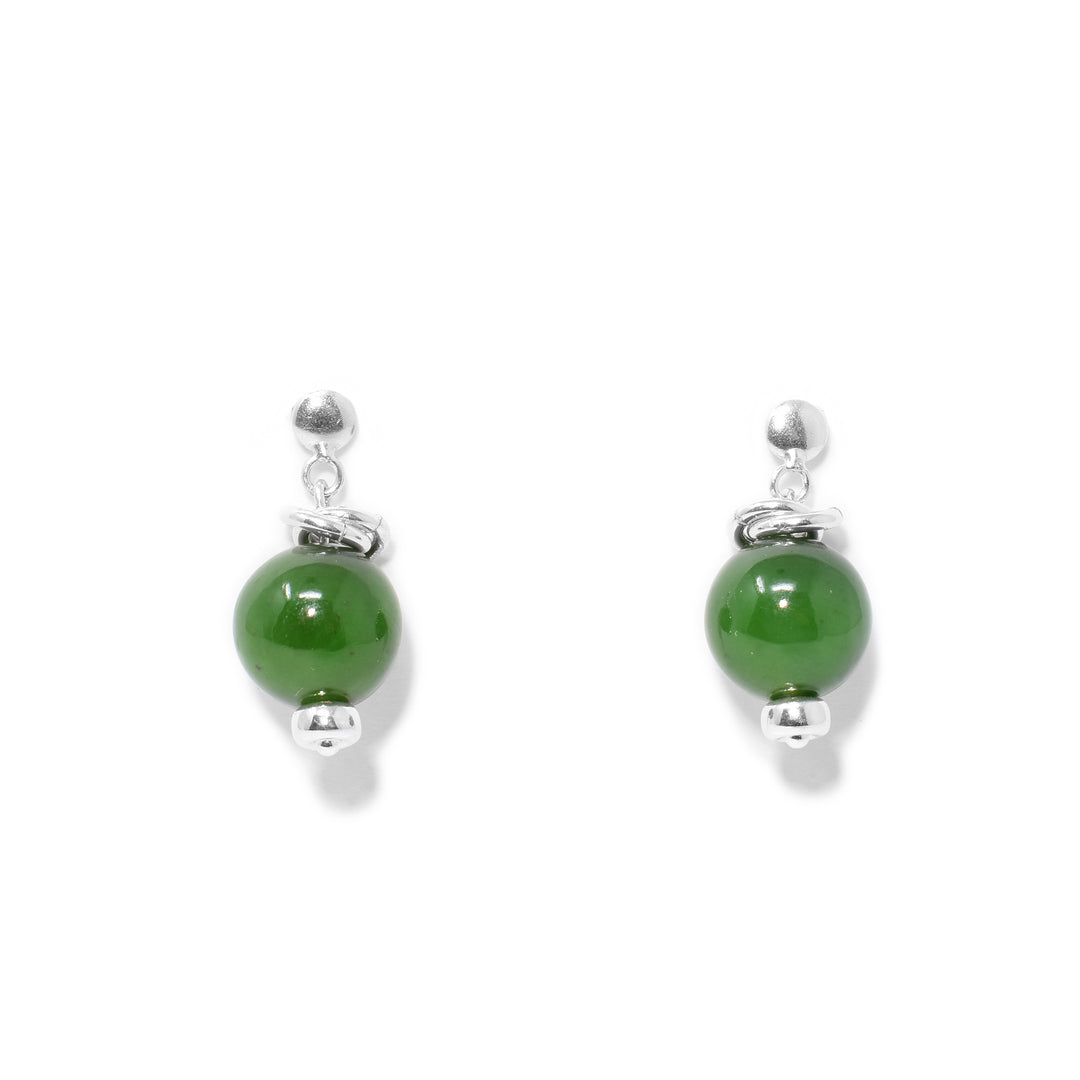 Round grade A BC jade beads with layered silver ring adornments above and thick silver beads below. All metal is sterling silver.