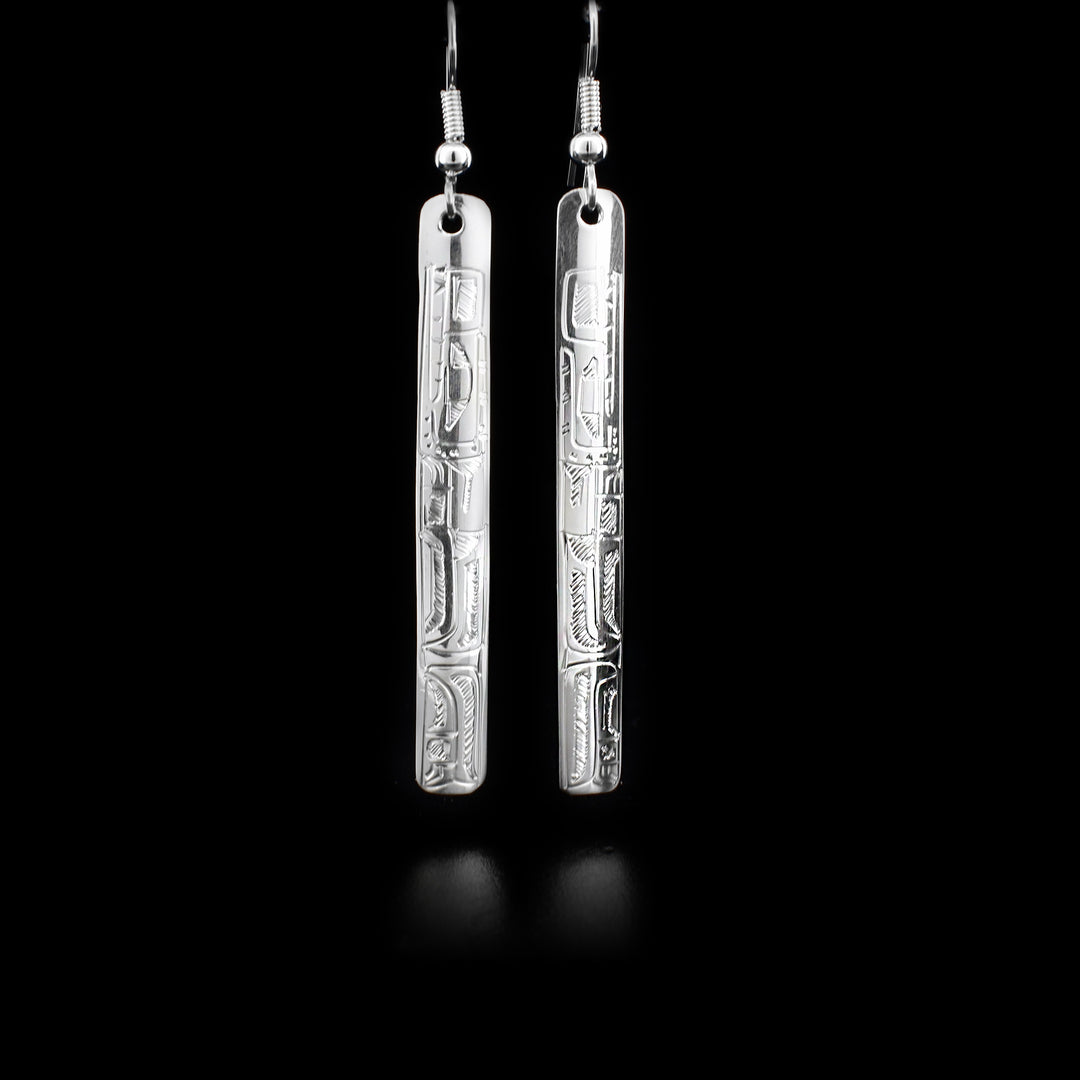 Long sterling silver rectangular dangle drop earrings featuring bears, hand-carved by Coast Salish artist Gilbert Pat.