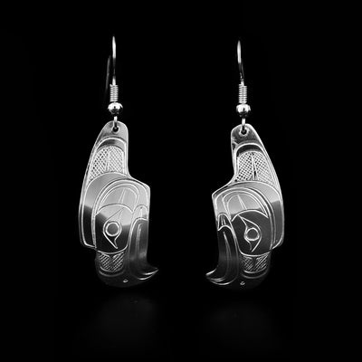 Domed eagle heads facing downwards. Sterling silver dangle earrings hand-carved by Coast Salish artist Travis Henry.