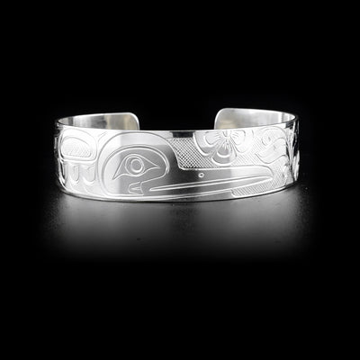 Sterling silver cuff bracelet depicting hummingbird and flowers.