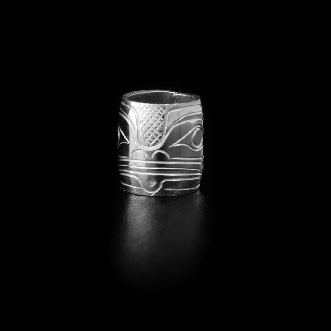 This Frog charm bead is made from sterling silver and there is a depiction of the frog craved into the surface of it.
