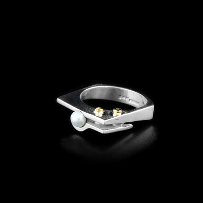 Square sterling silver ring featuring white freshwater mabe pearl and two dainty 14K gold bolt adornments. Abstract design. By Ivan Dobren.