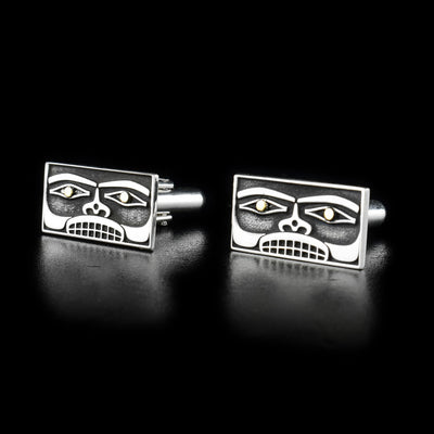 Sterling silver cufflinks inspired by Chilkat bentwood boxes. 14K yellow gold in eyes. Laser-carved design. By Tahltan artist Grant Pauls.