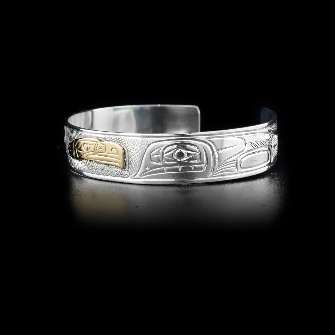 Left side of bracelet showing carved designs.