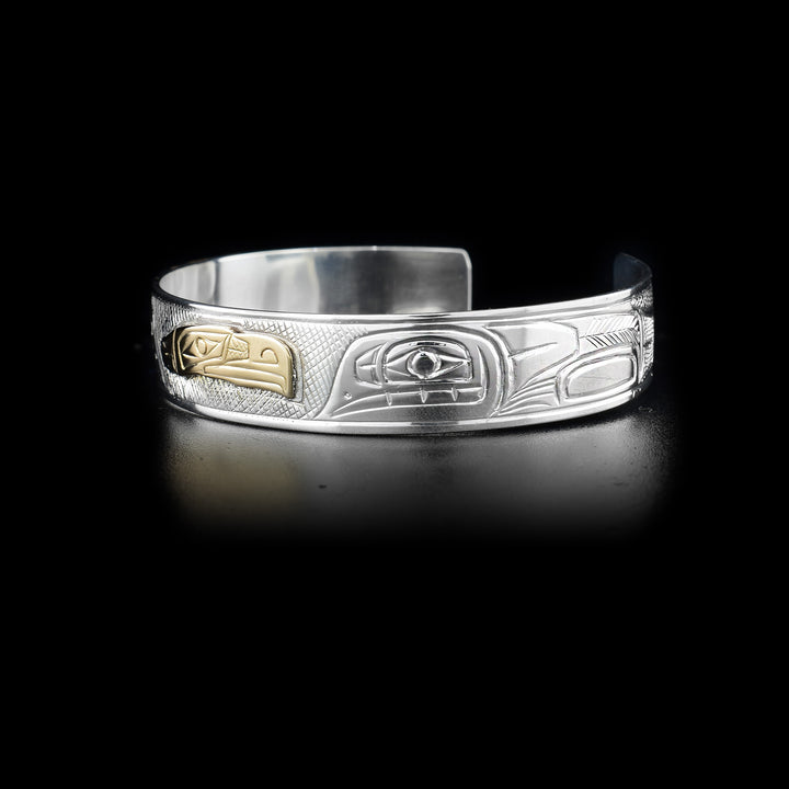 Left side of bracelet showing carved designs.
