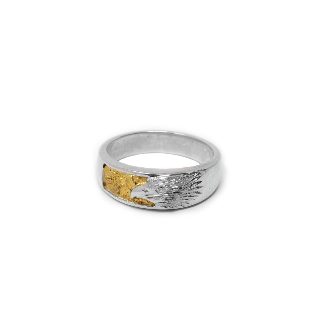 Sterling silver side-view of realistic eagle head on front with 22K gold nugget background.