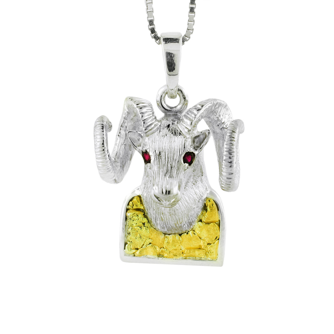 Sterling silver ram's head with a  Gold Nugget base, and red garnet used for the eyes of the ram.