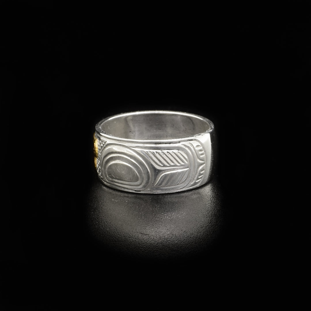 Left side of ring with carved designs.