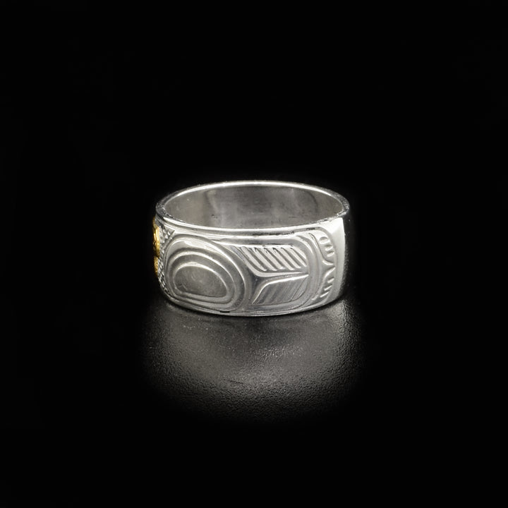Left side of ring with carved designs.