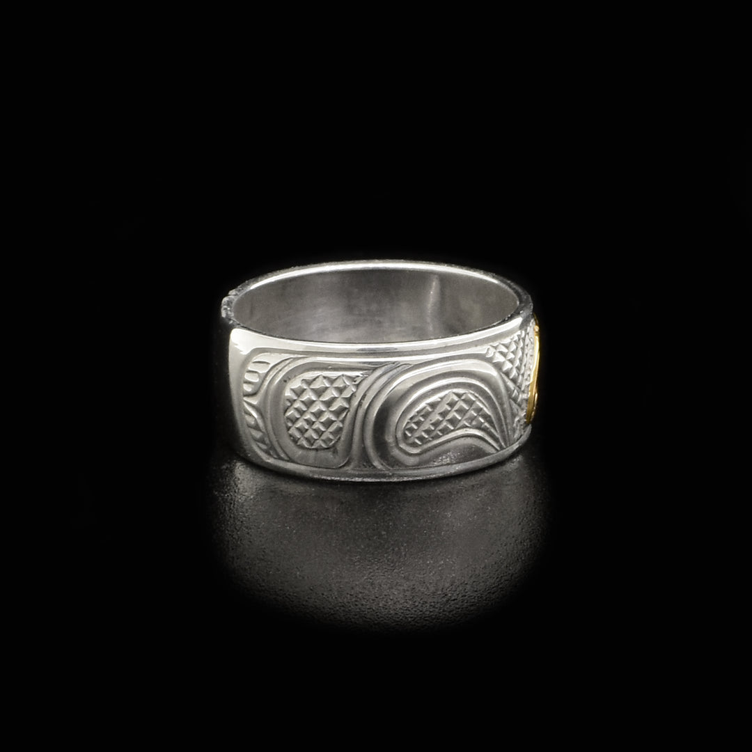 Right side of ring with carved designs.