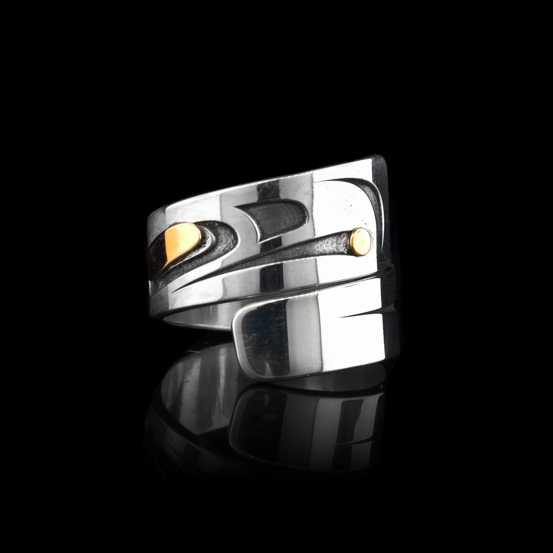 Silver & Gold Raven Wrap Ring. Made with sterling silver the raven is raven into the metal. It has a 14k gold eye and a gold pearl held in its beak.