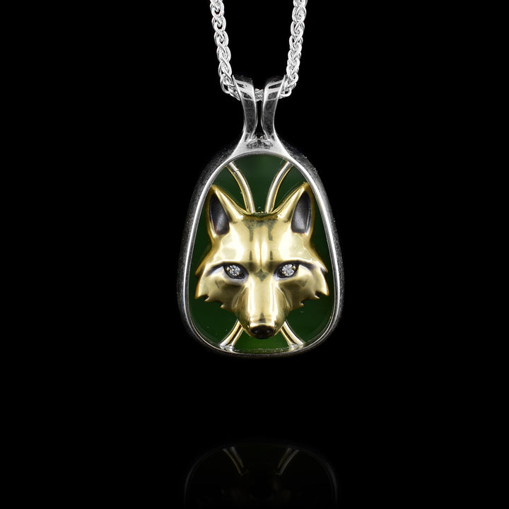 Silver & Gold Wolf Head Pendant, The wolf is made from gold sitting inside the BC Jade and framed with sterling silver. The wolf looks at you with it's diamond eyes.