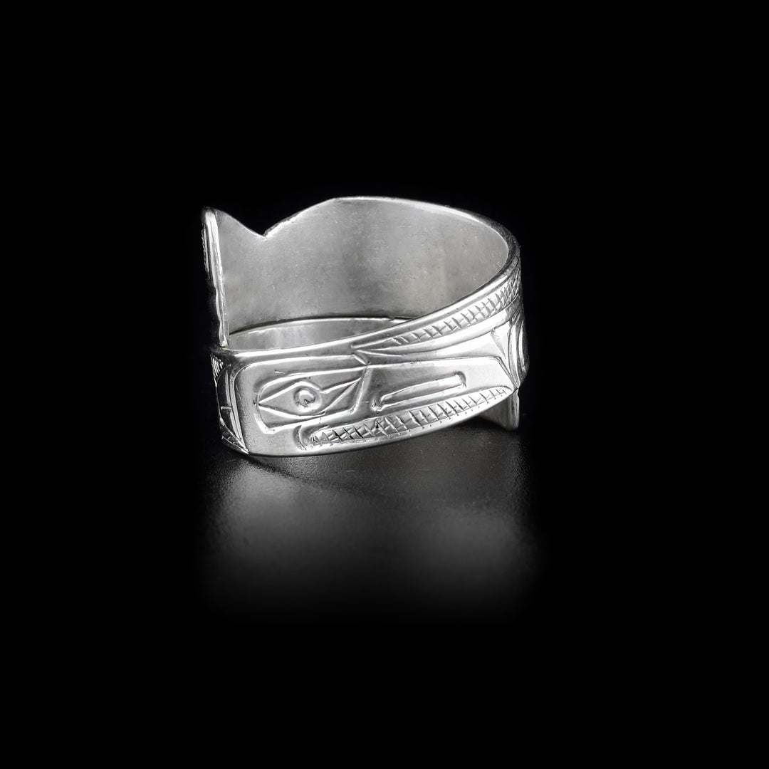 Back of ring with raven face and cross-hatching background.