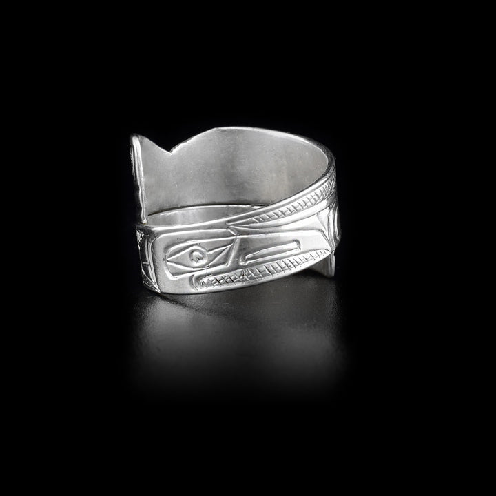 Back of ring with raven face and cross-hatching background.