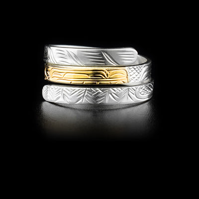Sterling silver triple wrap ring featuring wolf with face done in 14K yellow gold in middle. Hand-carved by Kwakwaka’wakw artist Victoria Harper.