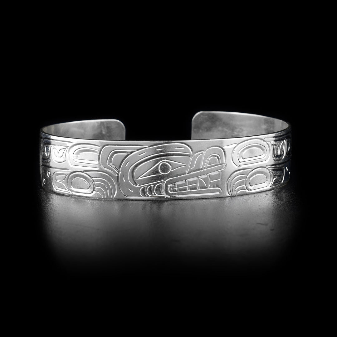 This Bear bracelet cuff has a single, sterling silver band with a gap in the back. Thee is a depiction of the Bear carved into the surface of the band.