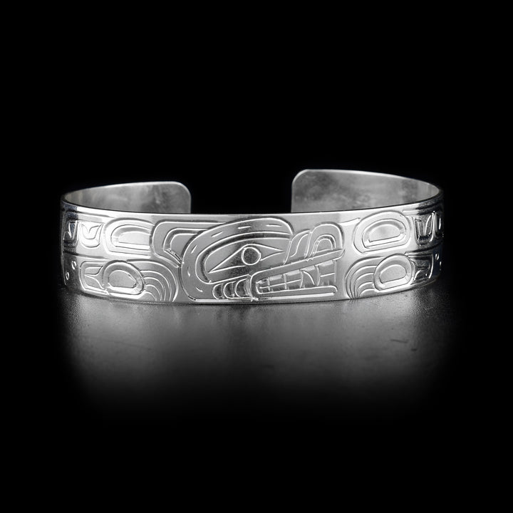This Bear bracelet cuff has a single, sterling silver band with a gap in the back. Thee is a depiction of the Bear carved into the surface of the band.