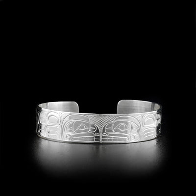 Sterling silver cuff bracelet featuring two bears facing each other.