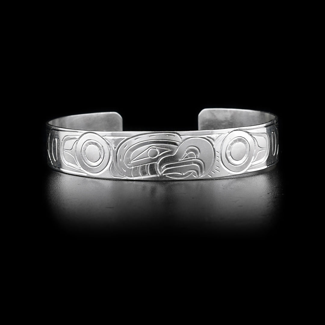 This Eagle bracelet has a single sterling silver band with a gap in the back. There is a depiction of the Eagle carved into the surface of the band.