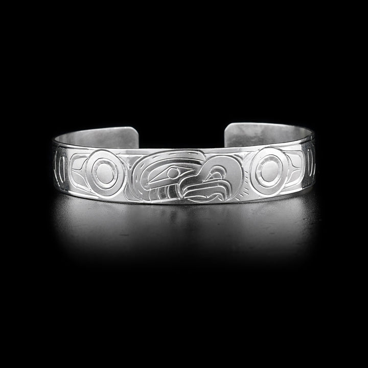 This Eagle bracelet has a single sterling silver band with a gap in the back. There is a depiction of the Eagle carved into the surface of the band.