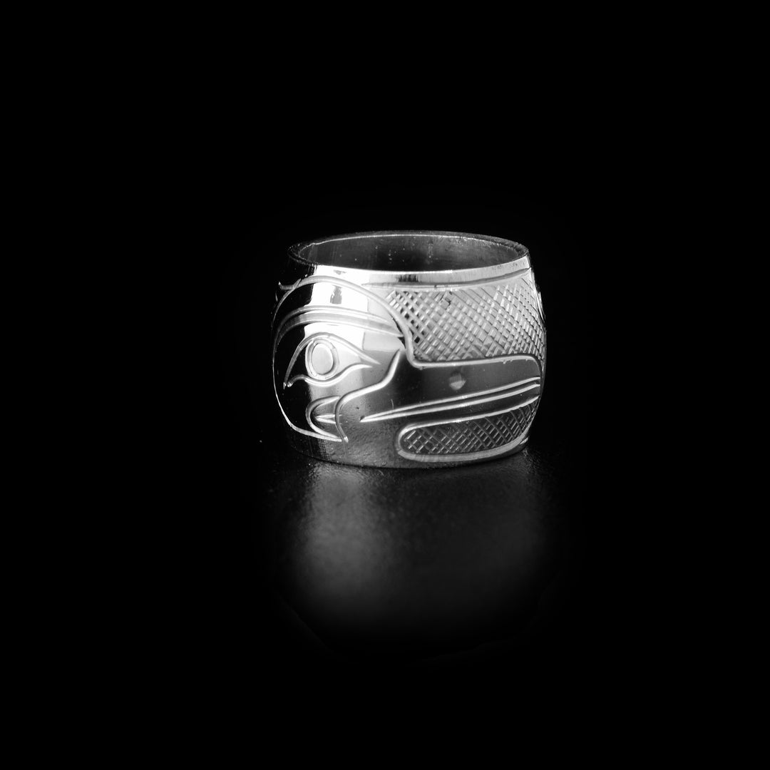 These spirit beads are made from sterling silver and there is a depiction of the Heron carved into the surface of it.