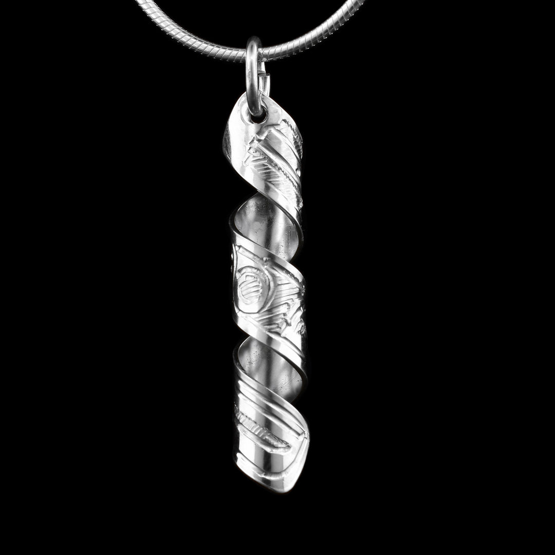 This Hummingbird spiral pendant is made out of a sterling silver strip which has the face and body of the Hummingbird carved on it and then coiled into a spiral.