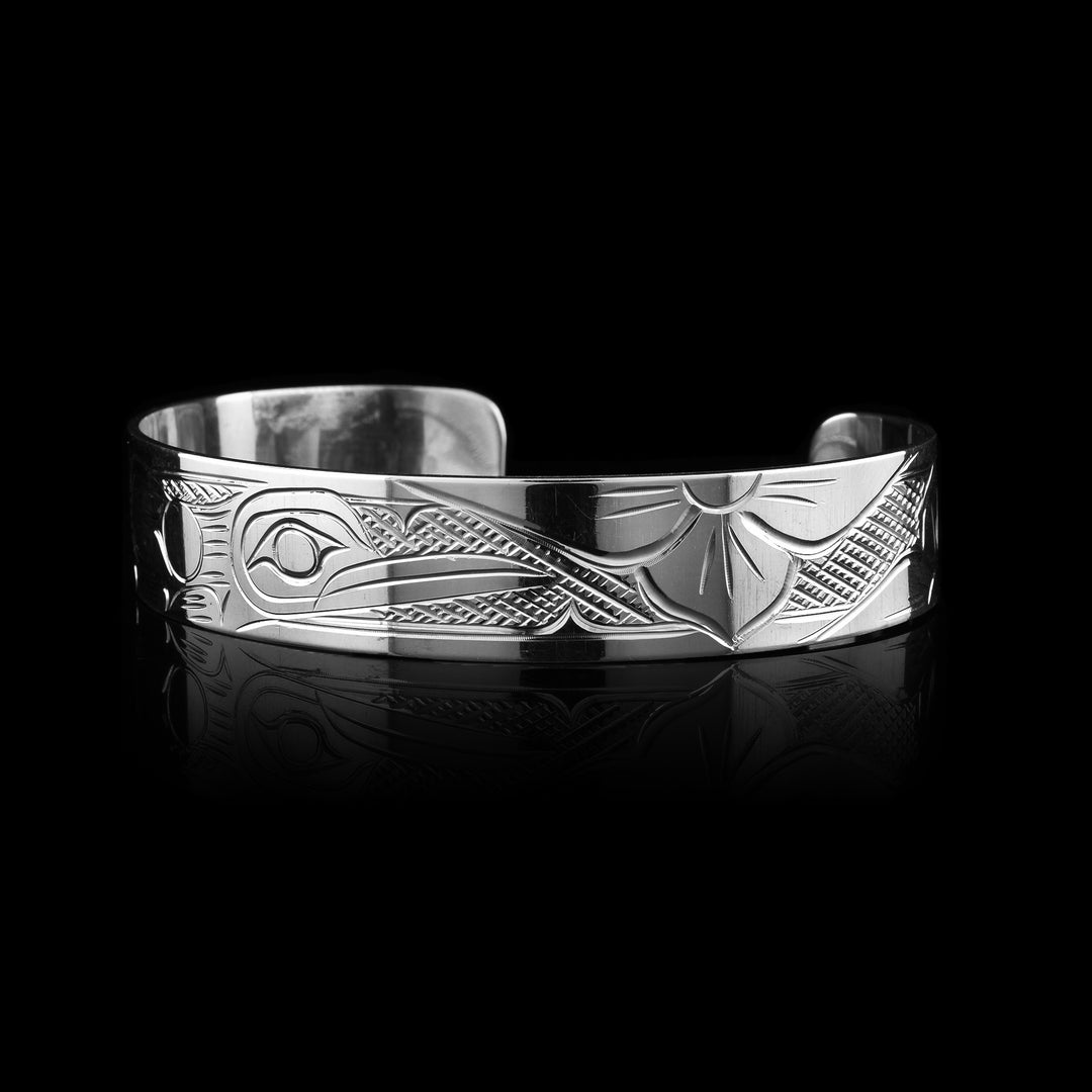 Sterling silver cuff bracelet with the Hummingbird legend carved into it. 