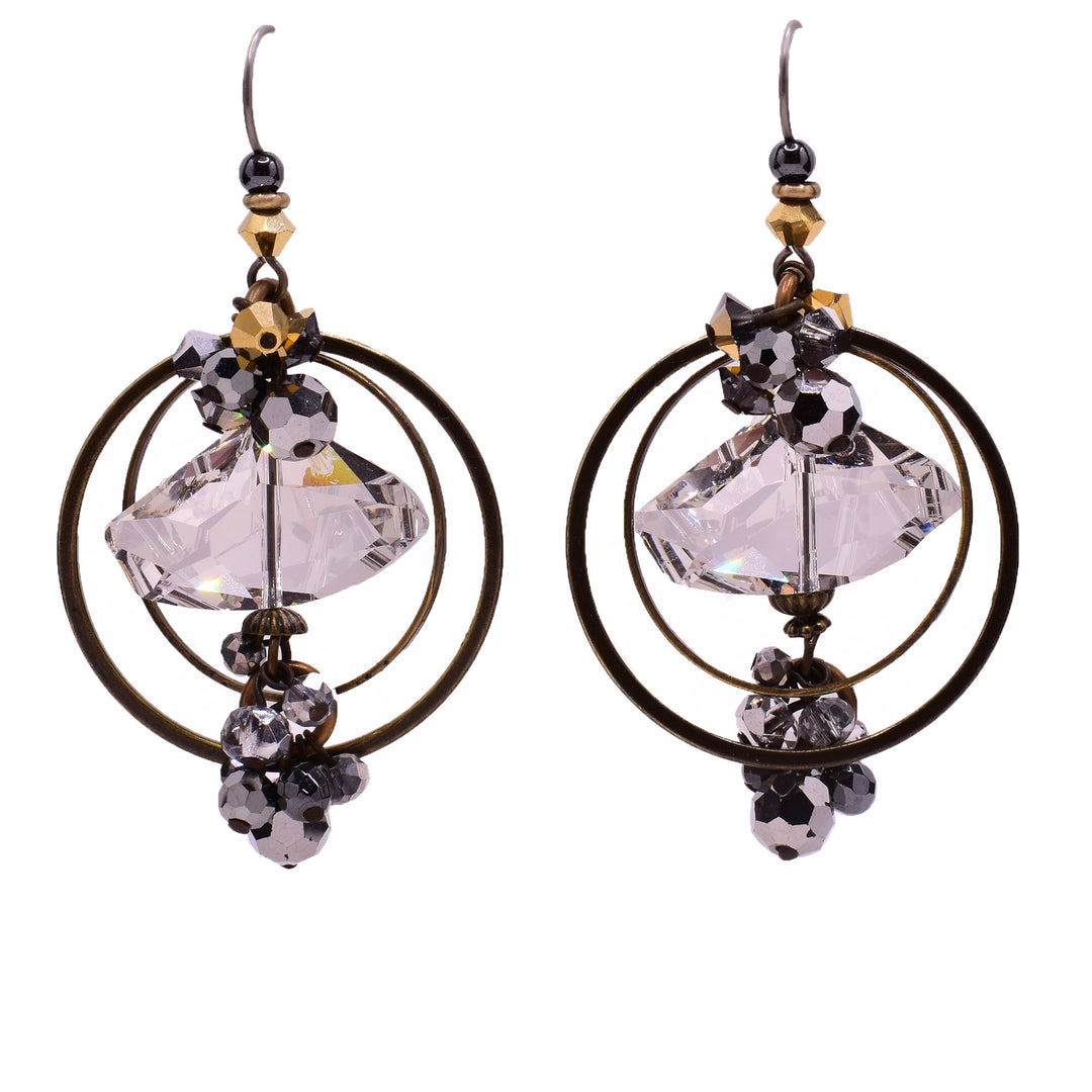 Dangle earrings made of Austrian crystal and handworked brass. Titanium hooks. By Honica.
