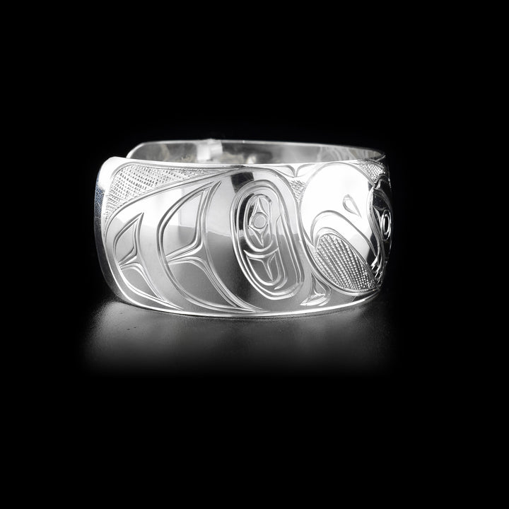 Right side of sterling silver cuff bracelet featuring eagle body and part of head.