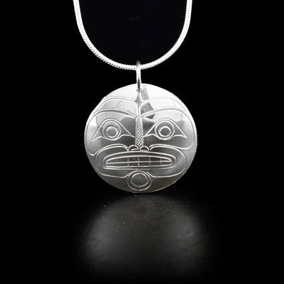 Round sterling silver moon pendant with jump ring. Hand-carved by Coast Salish artist Travis Henry.