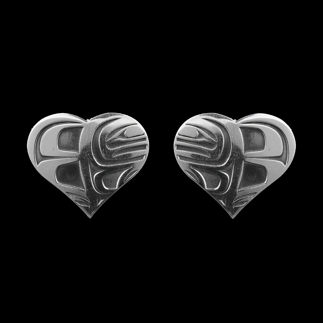 Sterling Silver Heart shaped earrings oxidized orcas make up the design on the inside of the heart. 