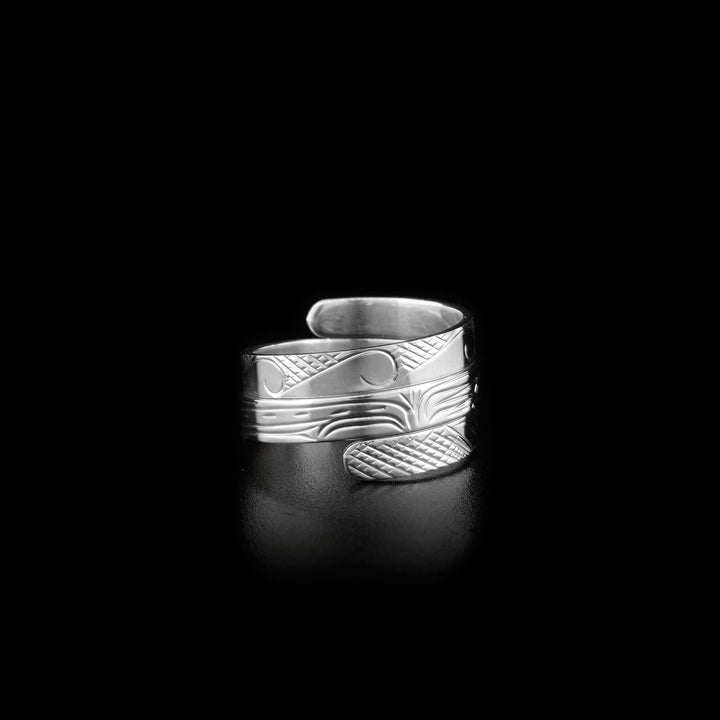 Side-view of ring showing part of waves and orca.