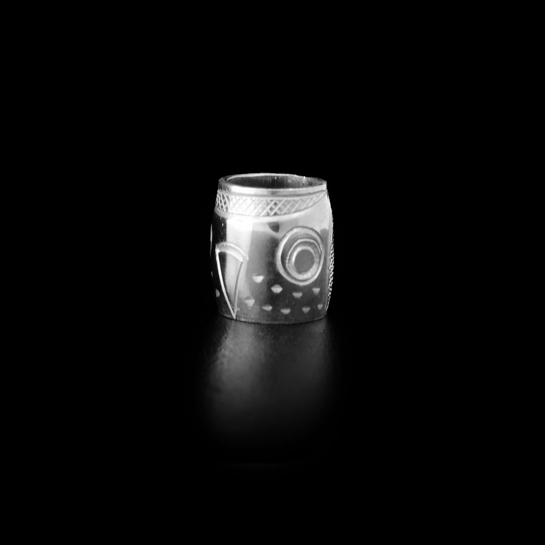 Sterling silver owl charm bead by Coast Salish artist Travis Henry.