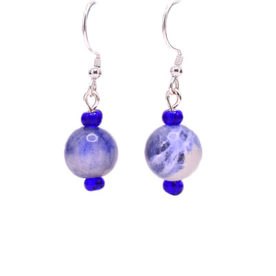 Round, light sodalite beads with little blue glass beads above and below. Sterling silver hooks.